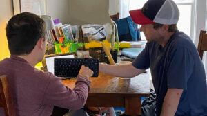 Austin working with a client
