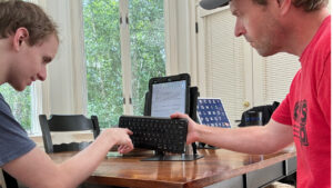 Austin working with a client