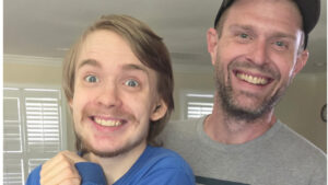 Austin poses with a happy client